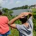 Bystanders look on as Washtenaw County Sheriff's Office investigators search Ford Lake. Melanie Maxwell | AnnArbor.com 